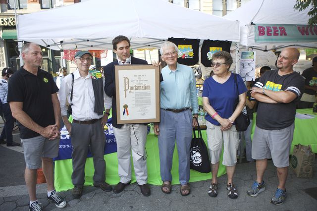 City Council Member Ben Kallos holds the proclamation<br>